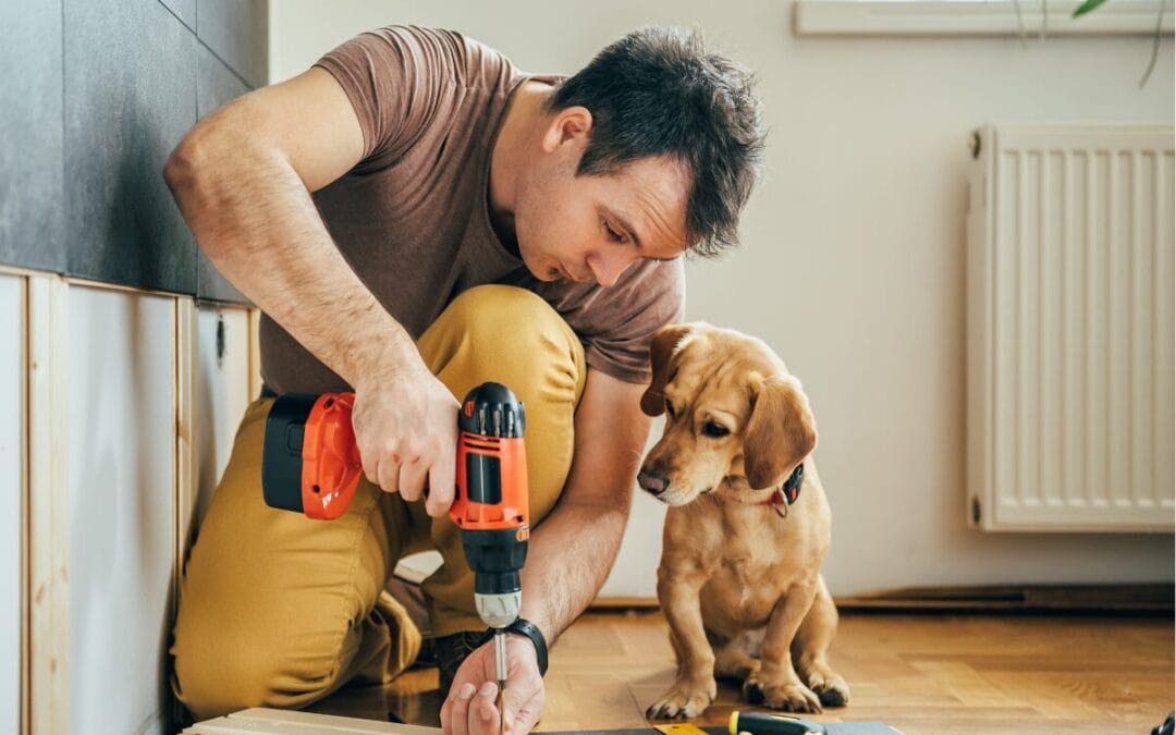 Man Buying a home with potential and dog looking on